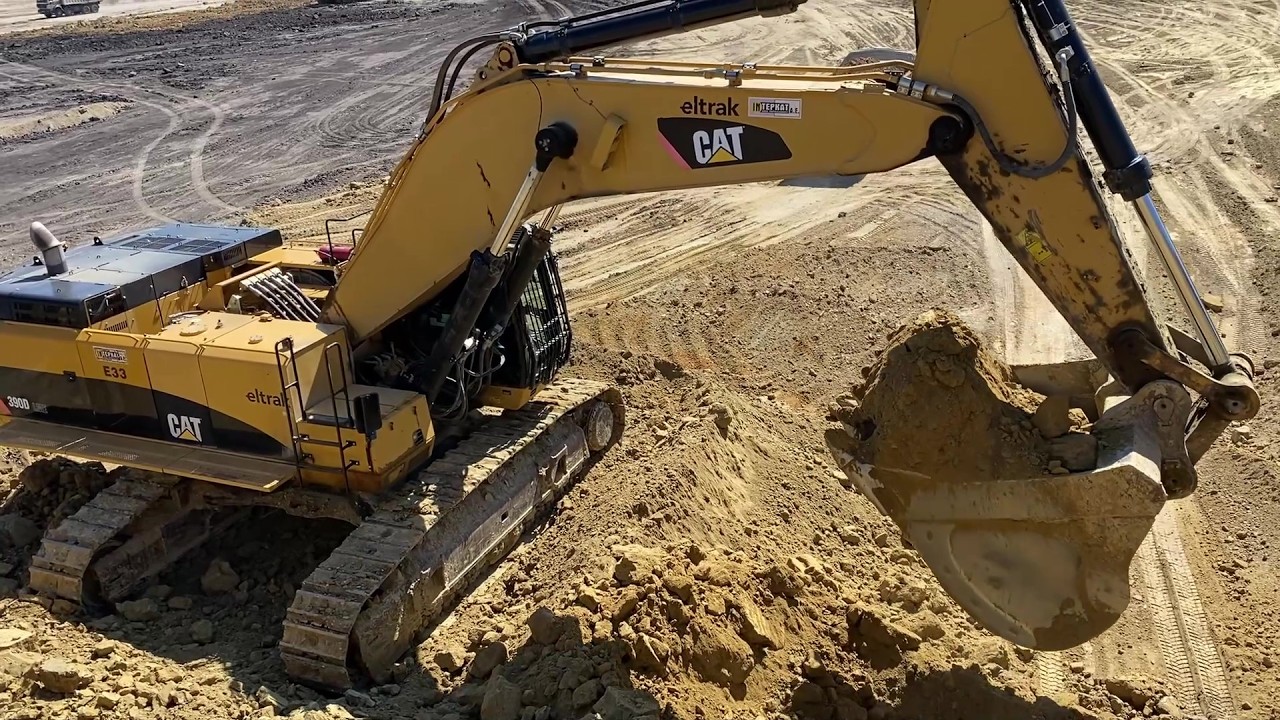 Caterpillar 390D Excavator Loading Overburden At A Massive Mine Site - Operator View - Interkat SA