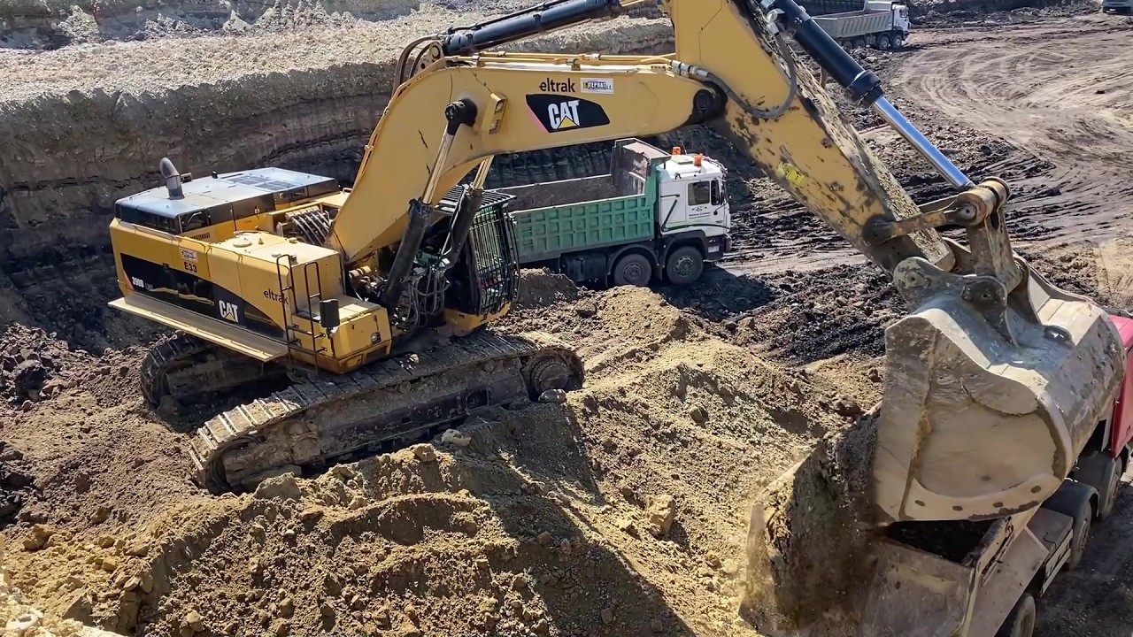 Double-Bench Mining In Action: Caterpillar 390D & 365C Excavators Load Overburden - Interkat SA